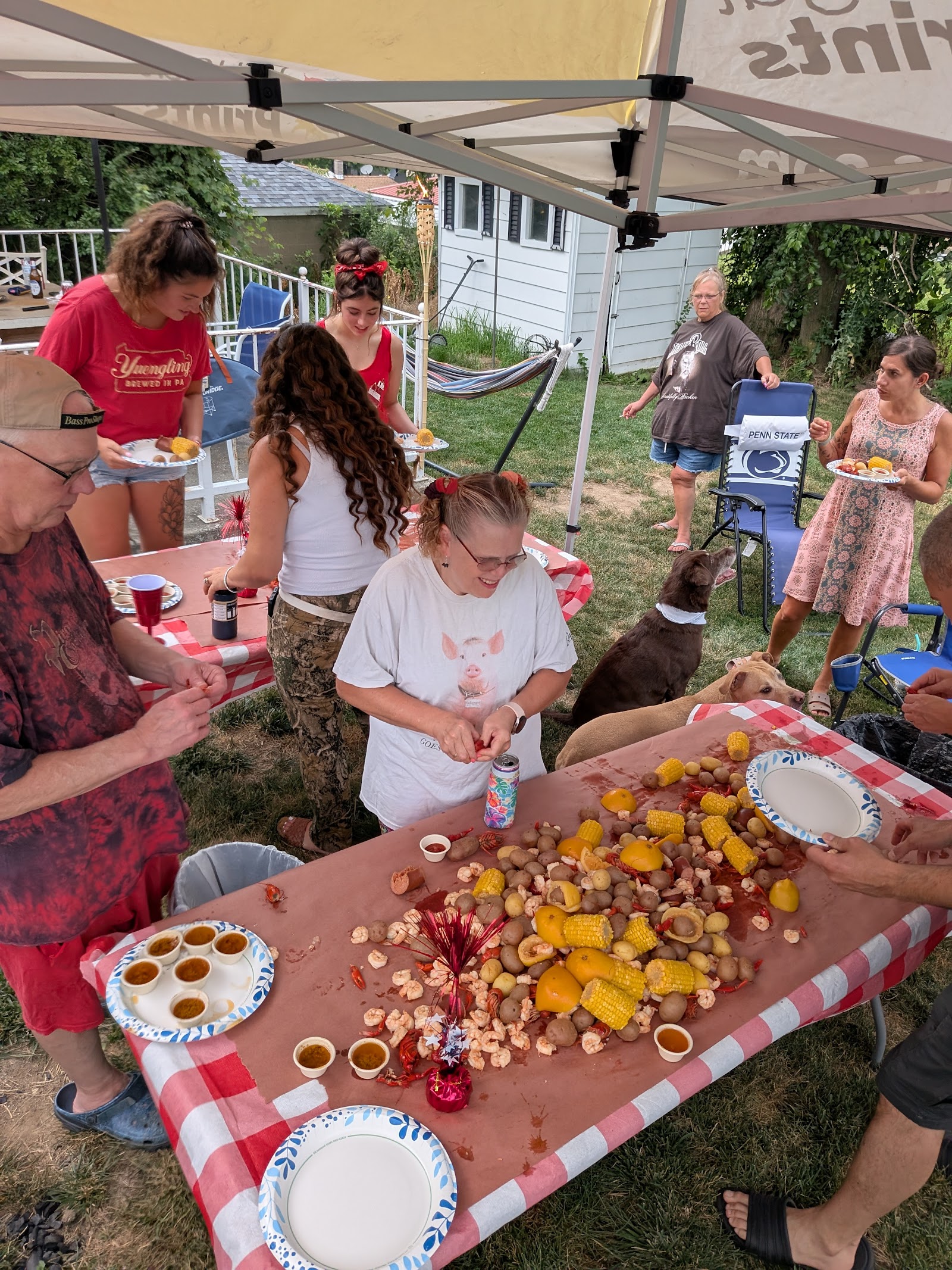The crowd digging into the boil dumped across the table