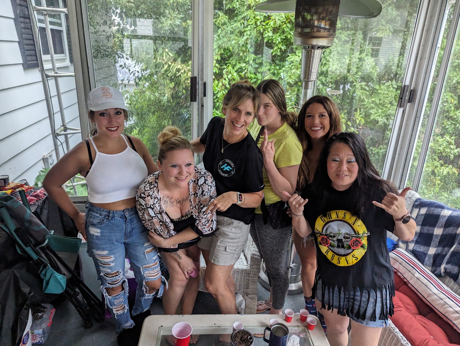 The ladies of the bash crowded together on the porch